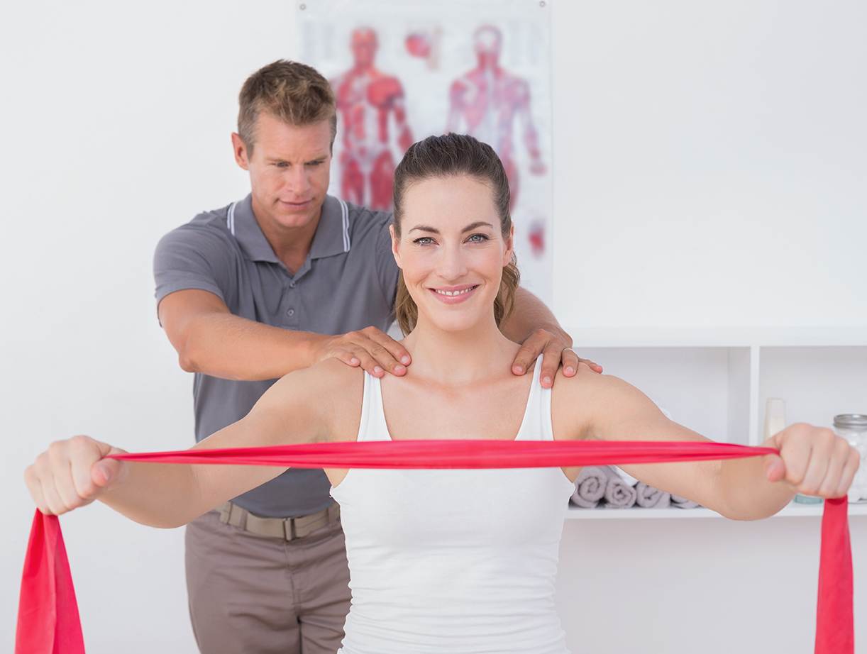 Doctor examining his patient back in medical office