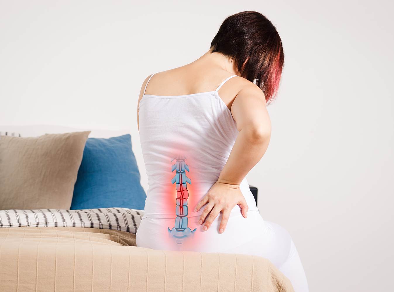 Woman experiencing lower back pain, highlighting spinal issues treatable with non-surgical decompression therapy in Dublin.